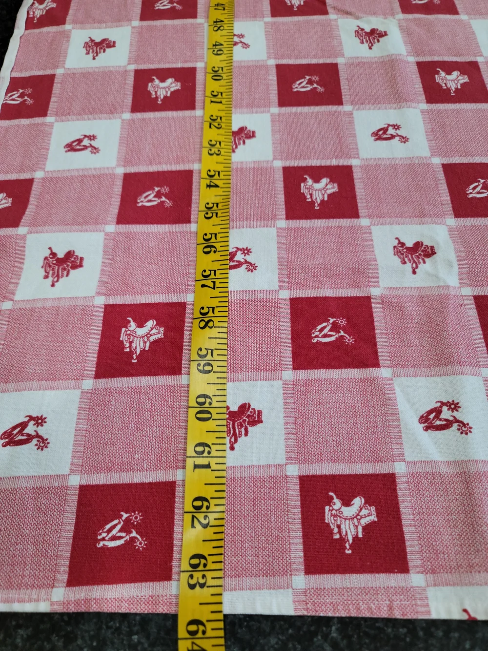 Vintage red and white checkered tablecloth small western-style horse saddle